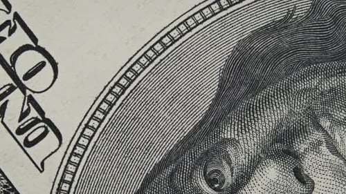 One Hundred Dollar Banknote Rotate in Extreme Macro Benjamin Franklin Portrait