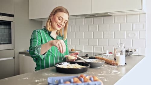 Woman Baking a Pie in Home Kitchen
