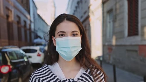 Woman Wearing Mask in City Close Up