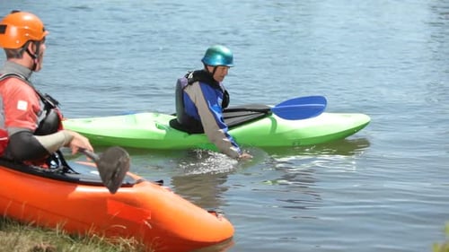 Three Men Kayaking on a Sunny Day