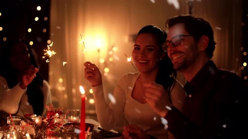 Friends Celebrate with Sparklers at Warm Holiday Dinner