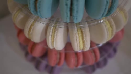 Macaron Tower - Assorted Sweet Macarons On Transparent Macaron Display Stand. closeup, descend