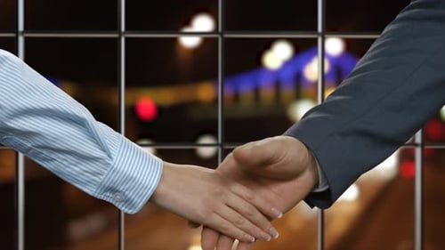 Handshake Near Window with Night City Traffic
