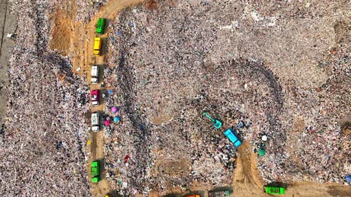 An aerial view over a landfill. 4K.