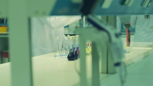 Scientist Using Micropipette in a Lab