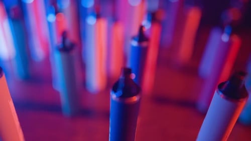 Colorful Vape Pens with Atmospheric Lighting Close Up