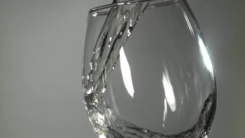 White Wine is Poured Into a Glass Filmed on a Highspeed Camera at 1000 Fps