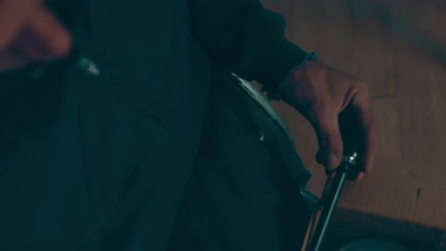 A Disabled Man Assembles a Stroller