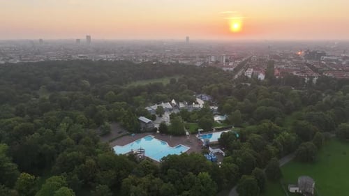 Aerial view of public pools and greenery at sunset, Germany.