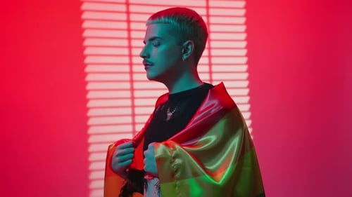 Confident Young Adult with Rainbow Flag Portrait