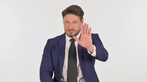 Man in Business Suit Makes Stop Gesture