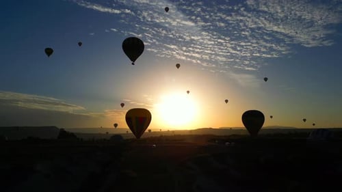 Hot Air Balloons Flying at Sunrise