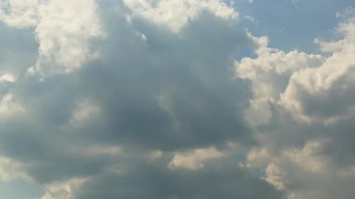 Fluffy Clouds Moving in the Blue Sky