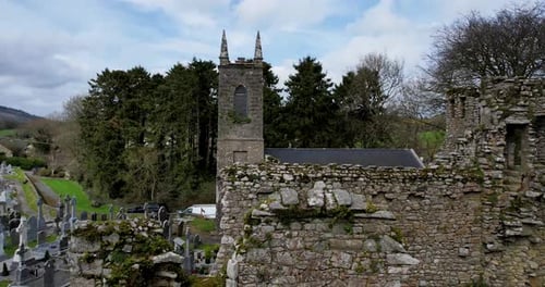 A rising drone shot of St Mullin's church of Ireland Monastic site and graveyard in County Carlow
