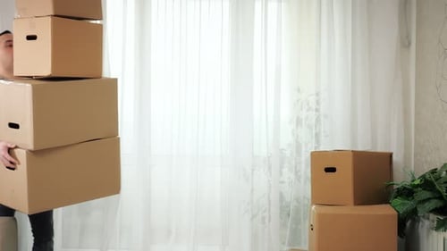 Man Carries Boxes Stack and Falls on Floor in New Apartment
