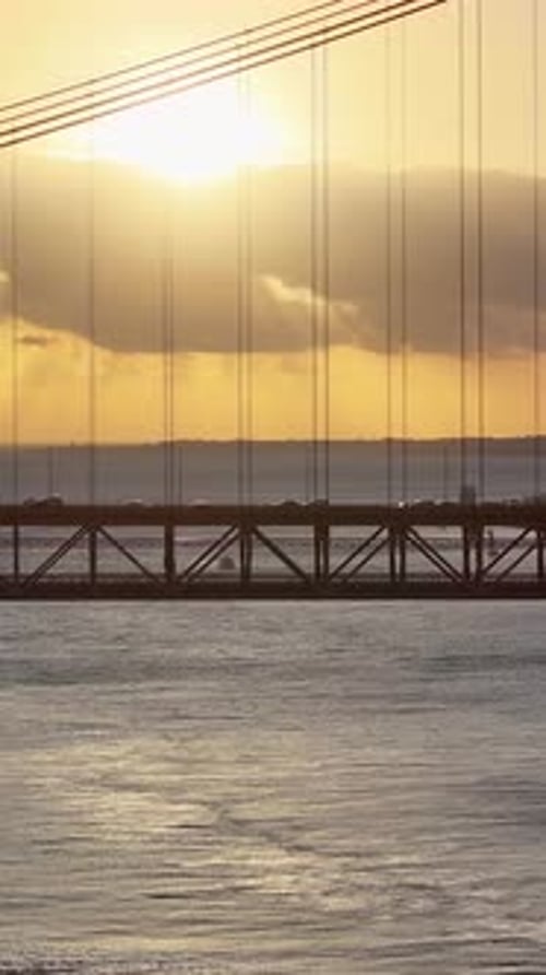 Sunset Skyline of 25th April Bridge at Lisbon in District of Lisbon Portugal.