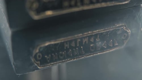 A close up detailed slow tilt up shot of a warrior ancient greek helmet sign, on a 360 rotating stan