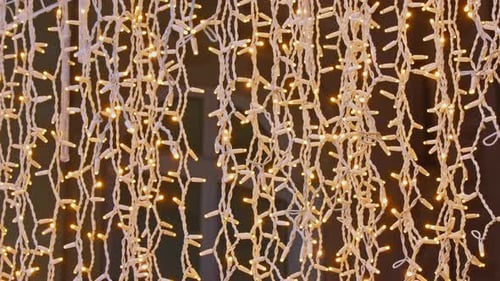 Lights of Hanging Garlands for New Year Christmas Street Decorations at Night