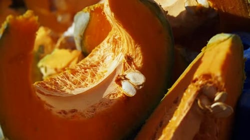 Detailed CloseUp View of Freshly Cut Pumpkin Pieces with Vibrant Color