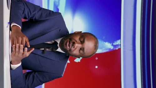Vertical Video African American News Anchor in Studio