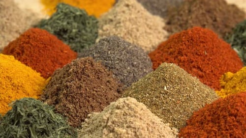 Spice and seasoning. Various fragrant spice market. Heap different Asian Spices rotated on wooden