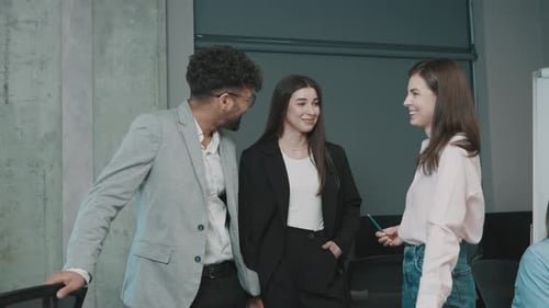 Business team collaborates in slow motion during a productive meeting in a modern office space