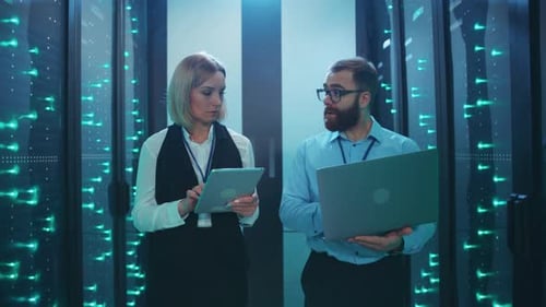 IT Professionals Working in Modern Server Room