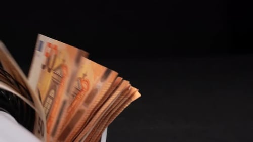 Money Counter Processing Stack of Euro Bills