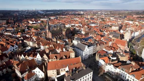Aerial view of medieval rooftops and buildings, Belgium.