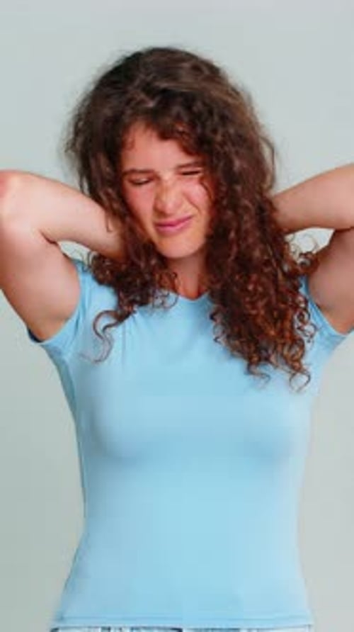 Woman Massaging Her Neck Due to Stiffness
