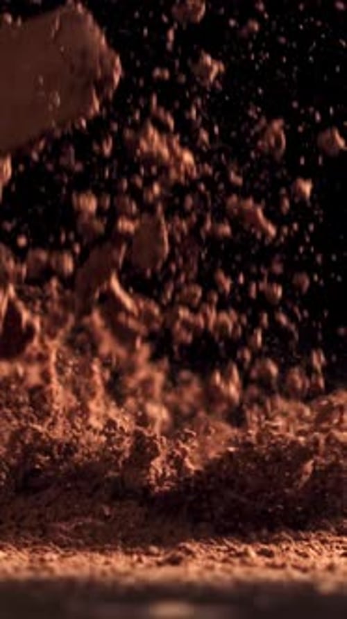 Cocoa Powder Falls on the Table Filmed on a Highspeed Camera at 1000 Fps