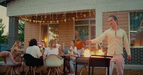 Friends Enjoying a Barbeque in a Suburban Backyard