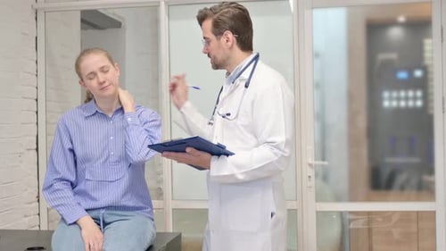 Young Adult Woman Consults Doctor About Neck Pain