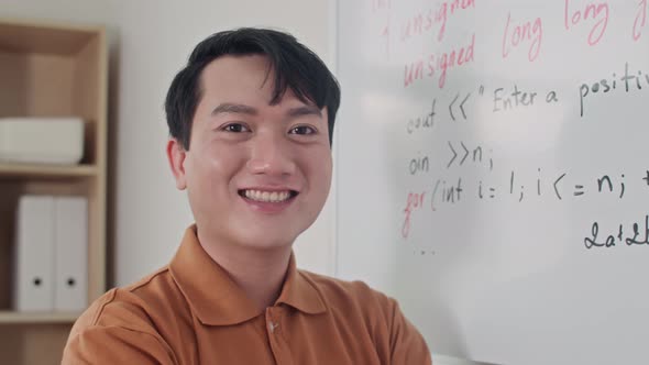 Portrait of Programmer Standing next to Whiteboard with Code at Office ...