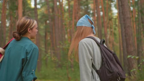 Hikers Pausing Thoughtfully in Peaceful Forest