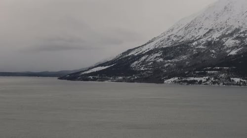 Bennett Lake With Snowy Mountain During Winter Season In Yukon, Canada. - wide shot