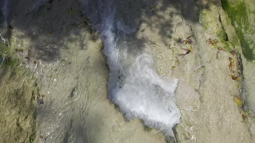 Aerial Top-Down Drone View of a River Waterfall in Slow Motion