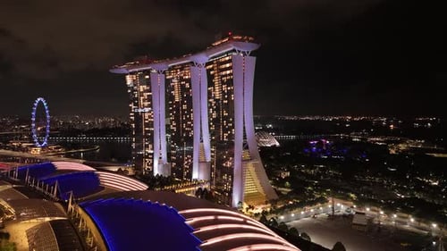 Modern Marina Bay Sands building complex in Singapore at night. Aerial