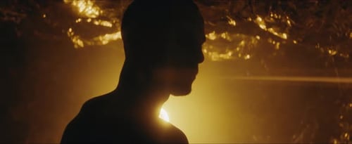 Silhouette of Person Against Bright Yellow Light