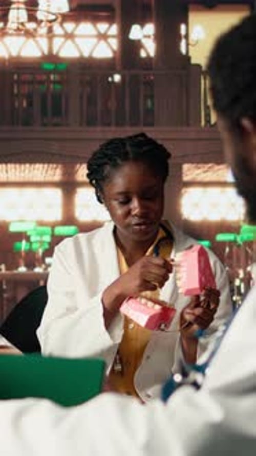 Medical Professionals Discussing Teeth in an Office