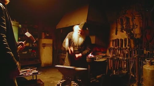 Blacksmith Hard at Work in Dark Workshop
