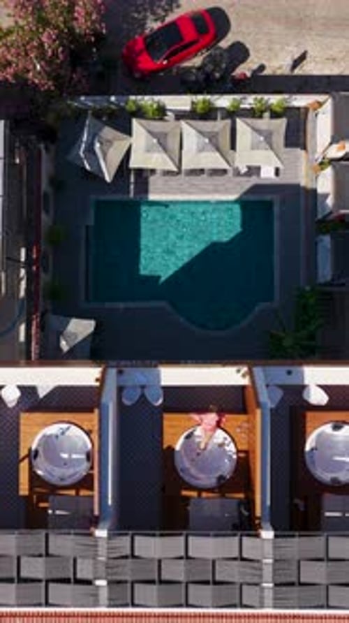 Vertical Video of Hidden Boutique Hotel Near the Shore With Clear Blue Water