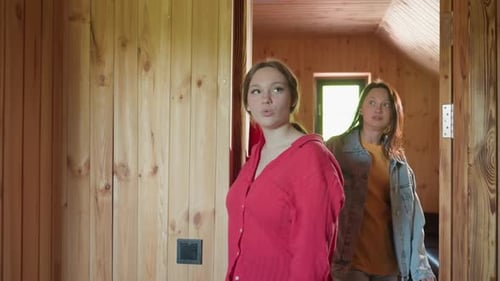 Students Entering Lounge with Wooden Interior and Observing Surroundings