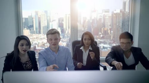 Excited Team Celebrating Success in Modern Office