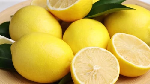 Fresh Lemons Still Life on Wood Plate
