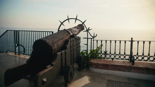 Historic cannon overlooking ocean from seaside viewpoint