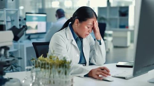 Stressed Scientist Working in Modern Laboratory