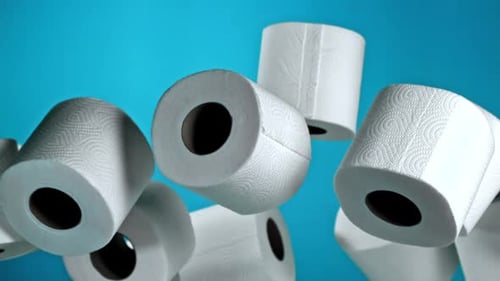 Toilet Paper Rolls Floating on Blue Background