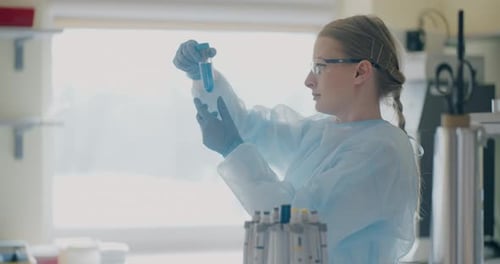 Scientist Examining a Test Tube in Lab
