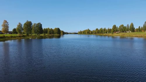 Calm River And Green Landscape Of Dalarna, Sweden - Aerial moving shot